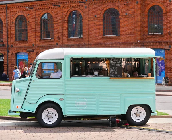 stock image Lodz, Poland - 08 07 2023 : Former Citroen van, converted into a food truck, selling homemade ice cream. The truck is located in the heart of the Manufaktura shopping center in Lodz.