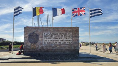 Dunkerque, France - 08 15 2024 : Memorial on the dike at Malo les Bains, Dunkirk. It reads To the glorious memory of the aviators, sailors and soldiers of the French and Allied armies... clipart