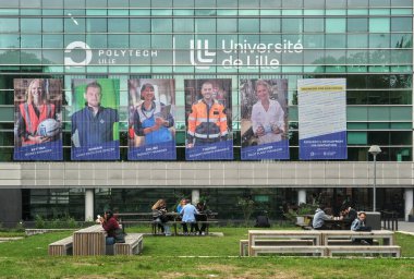 Villeneuve d'Ascq, France - 09 16 2024 : Students having lunch on the forecourt of one of Lille University's buildings. clipart