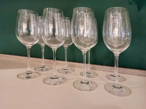 Transparent glass glasses on shelf. Decoration. Crystal.