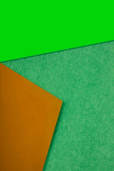 stock image color paper on the green background