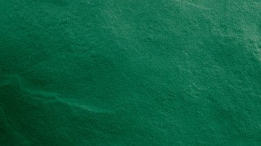 Doğal desenli yeşil keçeli arka plan. Tasarım için soyut duvar kağıdı. yüksek kaliteli fotoğraf