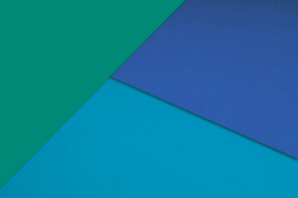 blue and green paper textured background. top view