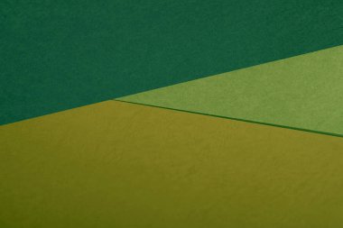 Kağıdın yeşil ve bej renginin soyut arkaplanı 