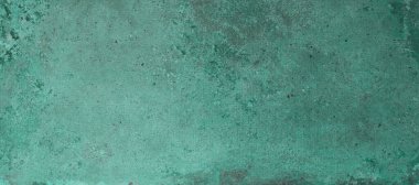 Arka plan için yeşil çiziklerle kaplı eski kırsal duvarın dokusu