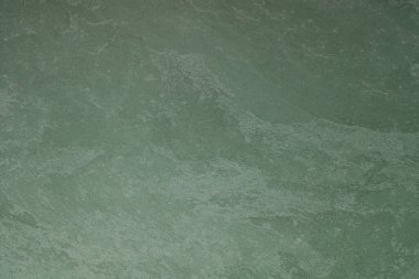 Siyah alçılı yeşil duvarın soyut arkaplan dokusu