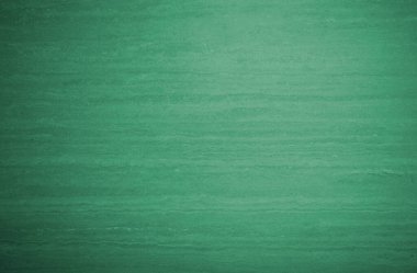 Doğal taş dokusunun yeşil arkaplanı, tasarım için boş yüzey.