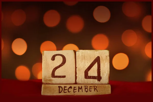 12月24日クリスマスイブのヴィンテージカレンダー お祝いのボケライトの背景 — ストック写真