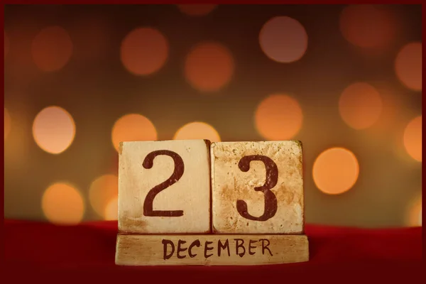 December Vintage Wooden Block Calendar Red Fabric Festive Bokeh Lights — Stock Photo, Image