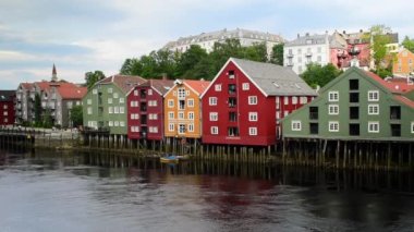 Colorful old houses on stilts along the Nidelva River, Trondheim old town, Norway