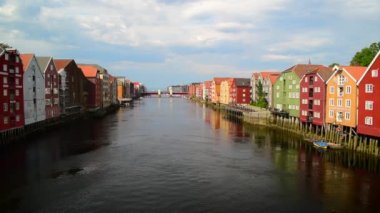 Colorful old houses on stilts on both sides of the Nidelva River, Trondheim old town, Norway