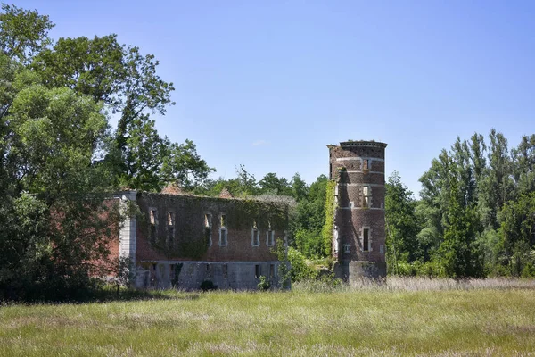 Round corner tower ruins of the old castle of Hollogne-sur-Geer near the Nature Reserve Du Haut Geer, Lige, Belgium, Europe