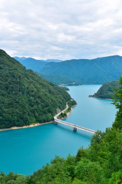 Bridge over lake Piva reservoir from Piva canyon viewpoint. Beautiful Montenegro nature landscape, explore the Balkans, travel Europe. clipart