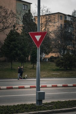 traffic sign with buildings in the background. High quality photo