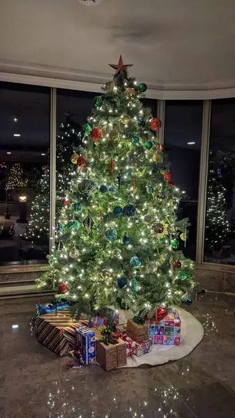 decorated christmas tree in the snow.