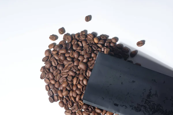 local coffee beans in black package on white background
