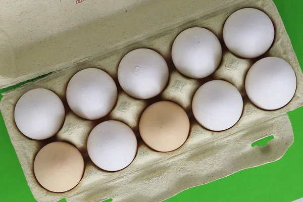 Ten eggs in an egg carton