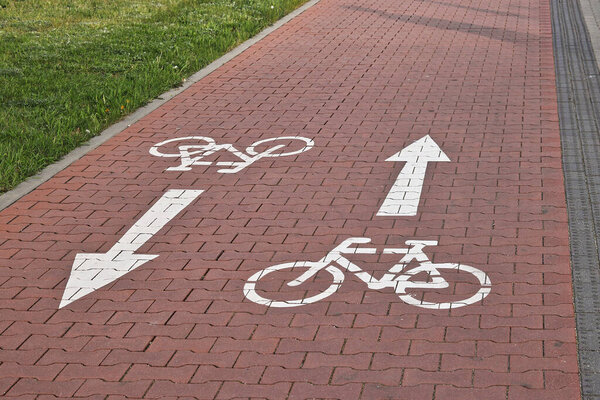 Bicycle path in the city with a sign painted on the ground