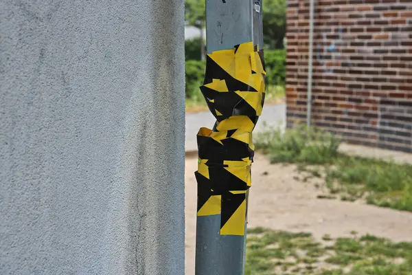 stock image Close-up of a very badly repaired gutter glued together with adhesive tape, botched work