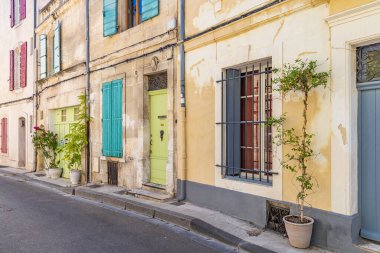Arles, Bouches-du-Rhone, Provence-Alpes-Cote d'Azur, France. Potted plants along a street in Arles.