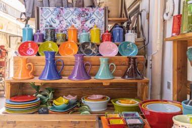 Saintes-Maries-de-la-Mer, Bouches-du-Rhone, Provence-Alpes-Cote d'Azur, France. July 3, 2022. Colorful ceramics for sale at a shop in Provence.