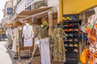 Aigues-Mortes, Gard, Occitania, France. July 4, 2022. Women's clothing for sale outside of shops in southern France.