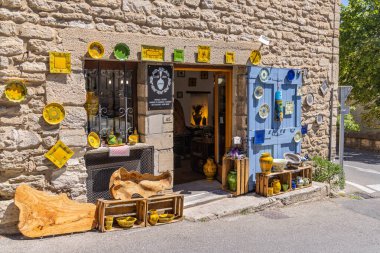 Gordes, Vaucluse, Provence-Alpes-Cote d'Azur, France. July 7, 2022. Colorful ceramics for sale in a shop in Provence.