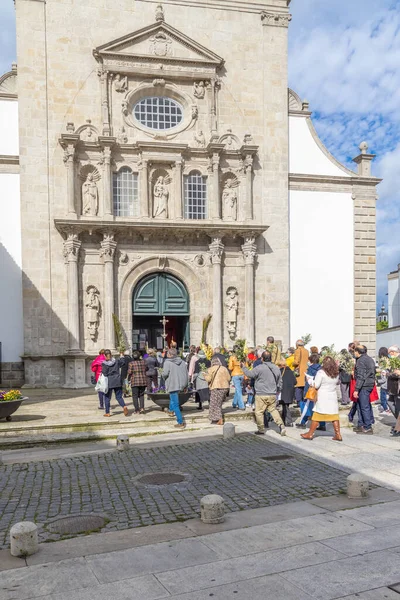 stock image Europe, Portugal, Viana do Castelo. April 10, 2022. Parishoners entering the Church of Saint Domingo on Palm Sunday.