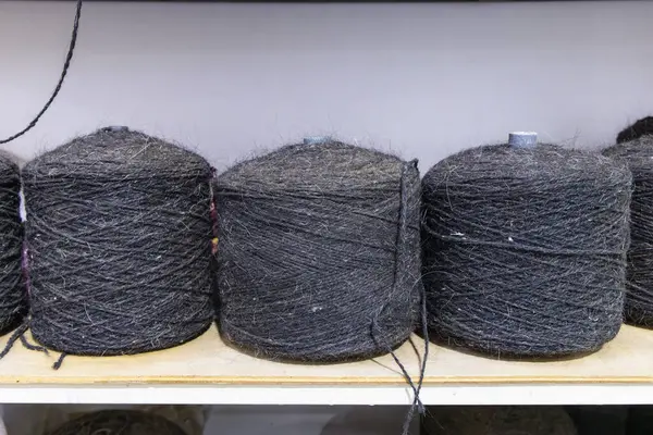 Middle East, Saudi Arabia, Tabuk. Spools of heavy wool trhead at a tent maker\'s shop.
