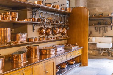 Harewood, Leeds, West Yorkshire, England, Great Briton, United Kingdom. May 2, 2022. Kitchen wares and copper pots in Harewood House, an 18th Century Treasure House. clipart
