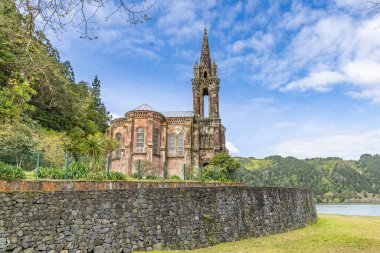 Lake Furnas, Sao Miguel, Azores, Portugal. Chapel of Our Lady of Victories on Sao Miguel Island. clipart