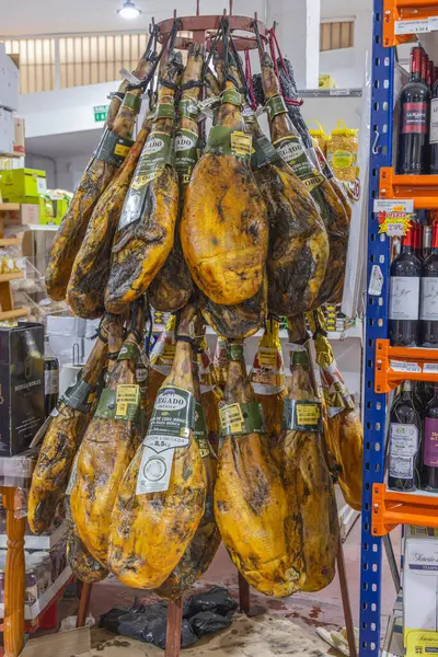 stock image Algatocin, Malaga, Andalusia, Spain. May 8, 2023. Iberico Hams for sale in a shop in Algatocin.