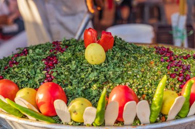 Pushkar, Rajasthan, India. Fresh salad with tomatoes, chili peppers and pomegranate seeds. clipart