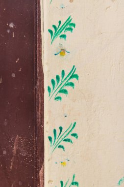 Devnagar, Ajmer, Rajasthan, India. Green leaf decorations on a house in Rajasthan. clipart