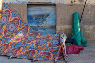 Al Wahat Al Baharia, Giza, Egypt. Colorful tarps in an alley. clipart