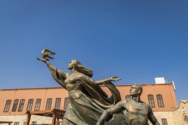 Al Khalifa, Old Cairo, Cairo, Egypt. March 2, 2023. Statue of a woman with a dove at the National Military Museum in Cairo. clipart