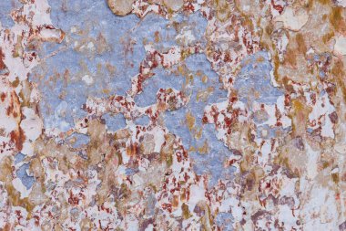 Antigua Guatemala, Sacatepequez, Guatemala. Boya soyuluyor ve eski bir duvar..