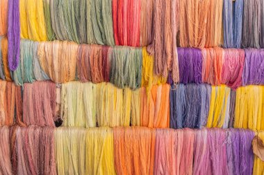 San Juan La Laguna, Solola, Guatemala. Colorful yarns for sale at a market near Lake Atitlan. clipart