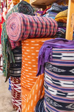 San Juan La Laguna, Solola, Guatemala. Colorful traditional woven cloth for sale at a market near Lake Atitlan. clipart