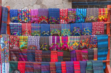 Santiago Atitlan, Solola, Guatemala. Colorful traditional woven cloth for sale in Santiago Atitlan. clipart