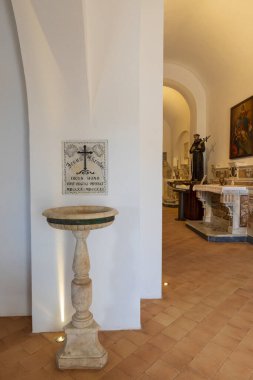 April 9, 2023. Italy, Basilicata, Maratea. Basilica di San Biagio atop Monte San Biagio. Interior. Baptismal font.