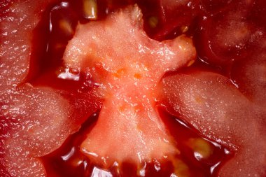 Arka plan olarak domates dokusu. Domatesin yakın çekimi. Makro fotoğraf. Domates.