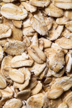 Arka plan olarak yulaf ezmesi dokusu. Yakından yulaf lapası. Makro fotoğraf. Yulaf ezmesi..