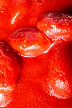 Arka plan olarak domates hamuru dokusu. Domates hamuruna yakın çekim. Makro fotoğraf. Domates püresi San Marzano. Yakın plan..