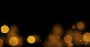 Altın bokeh parçacık arkaplanı. Siyah arkaplan, karıştırma modu ekranı kullan. Döngü Canlandırması