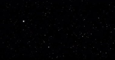 Lüks bir arka plan. Toz ve parıltı parçacıkları. Siyah arkaplan, karıştırma modu ekranı kullan. Döngü Canlandırması