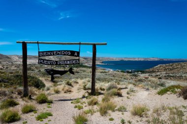 Puerto Piramides, Peninsula Valdes, Province of Chubut, Argentina. December 16, 2022. Puerto Piramides sign made of wood