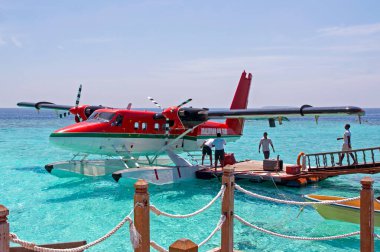 amphibious aircraft moored at the pier - blue sea - Maldives - DHC-6 Twin Otter