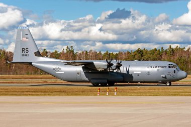 Military transport plane with blue sky - C-130J-30 Hercules