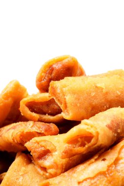 A bowl of Sumpia, Indonesian traditional mini spring rolls filled with shrimp floss. The crunchy outer wrapper is deep-fried to perfection. Photographed on a white background. clipart